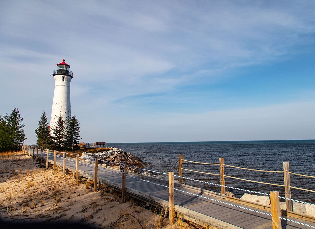 We Are Independent - Scenic View of a Lighthouse Next to Lake Superior Next to a Boardwalk on a Sunny Late Afternoon